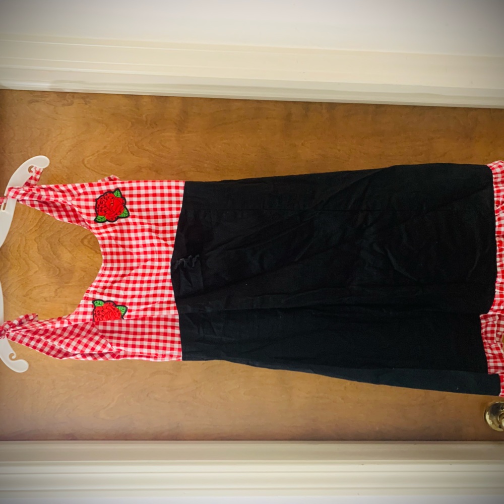 Red gingham and black pinup style dress with rose accents.